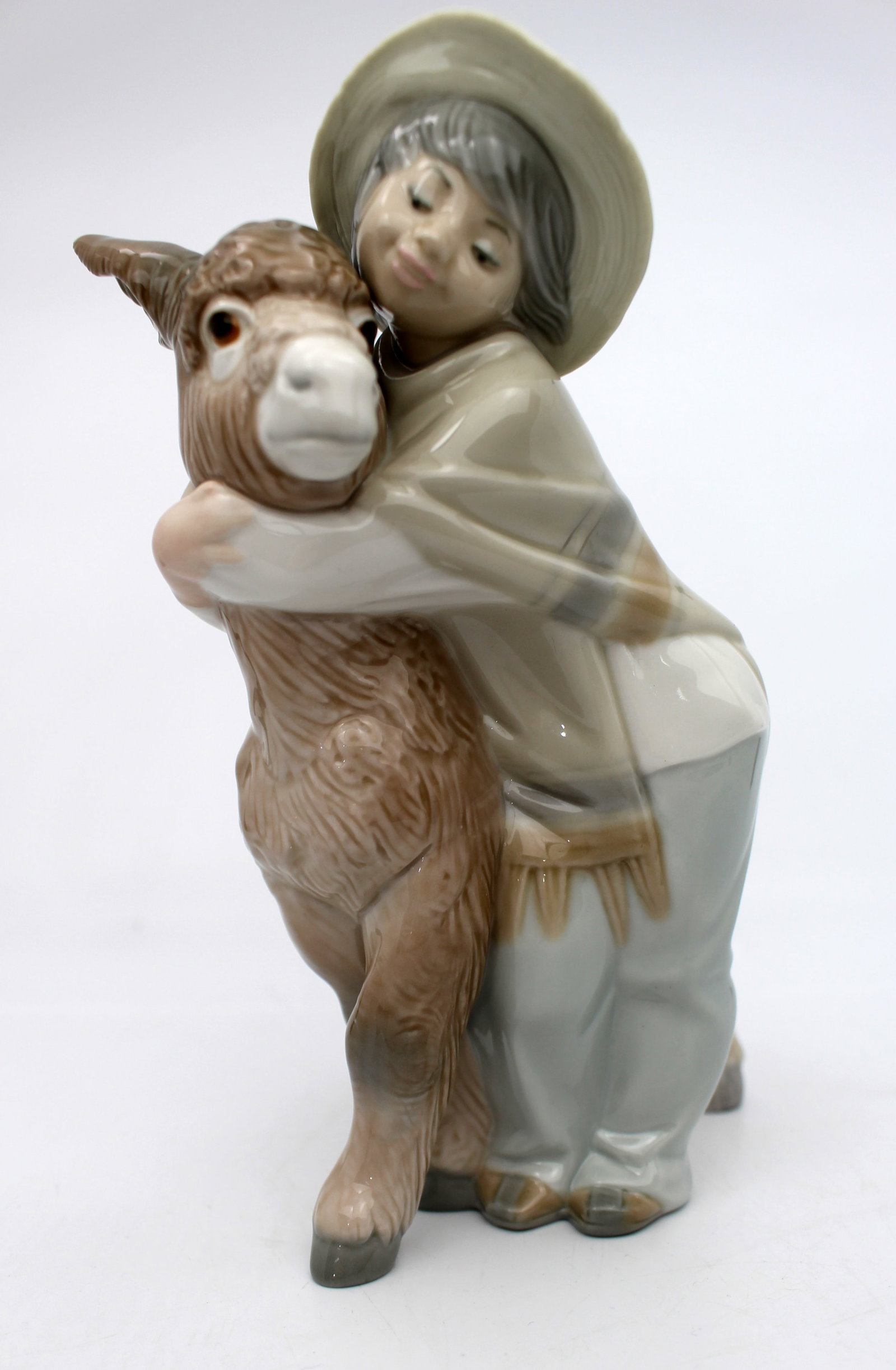 Title: Lladro Boy Hugging Donkey Description: Lladro Boy Hugging Donkey Measures 15 x 10 x 21 (: Title: Lladro Boy Hugging Donkey Description: Lladro Boy Hugging Donkey Measures 15 x 10 x 21 (height) cm. Very good condition; no chips, cracks or repairs. Condition: Used Delivery option: