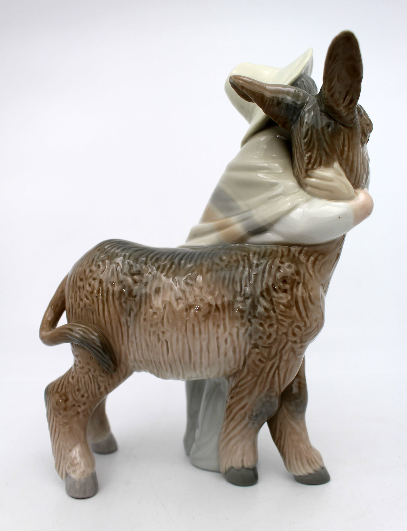 Title: Lladro Boy Hugging Donkey Description: Lladro Boy Hugging Donkey Measures 15 x 10 x 21 ( - 4