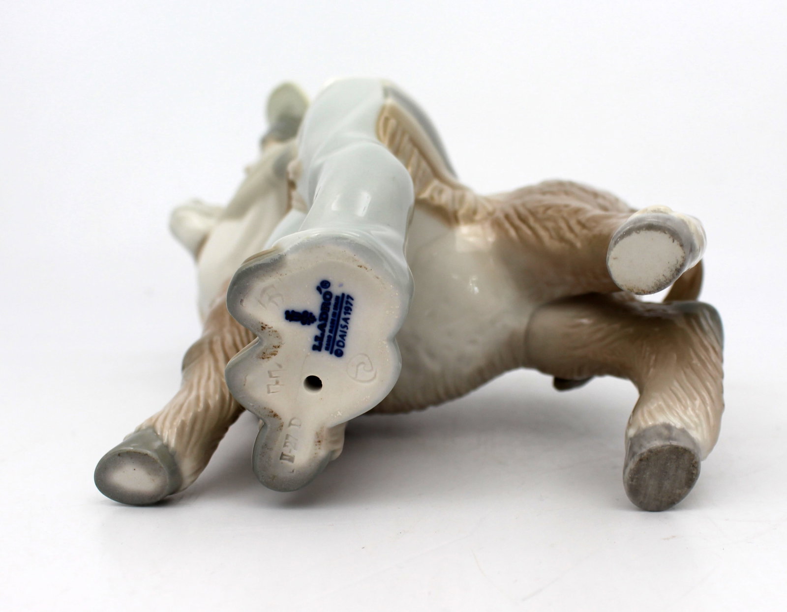 Title: Lladro Boy Hugging Donkey Description: Lladro Boy Hugging Donkey Measures 15 x 10 x 21 ( - 8