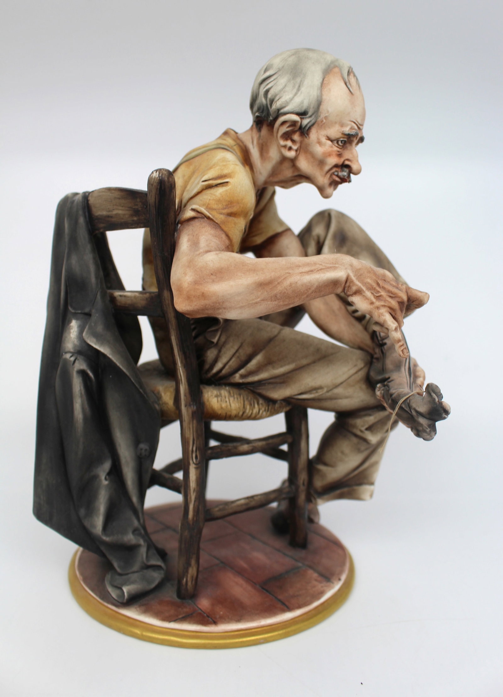 Title: Capodimonte Tramp Darning His Socks Description: Capodimonte Tramp Darning His Socks - 3