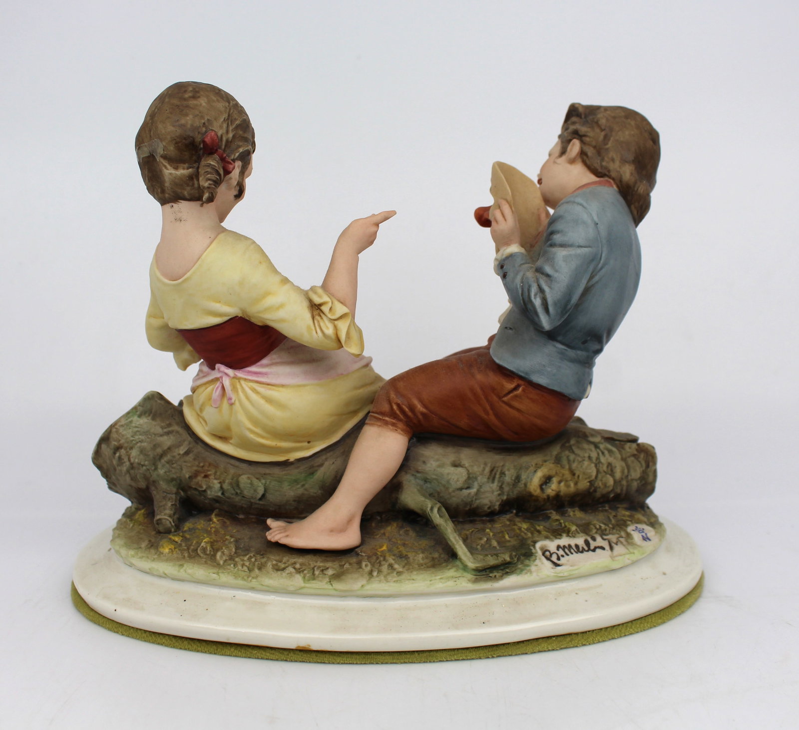 Title: Capodimonte Figurine Girl & Boy with Clown Mask by Merli Description: Measures 22.5 x 15 x 16 - 3