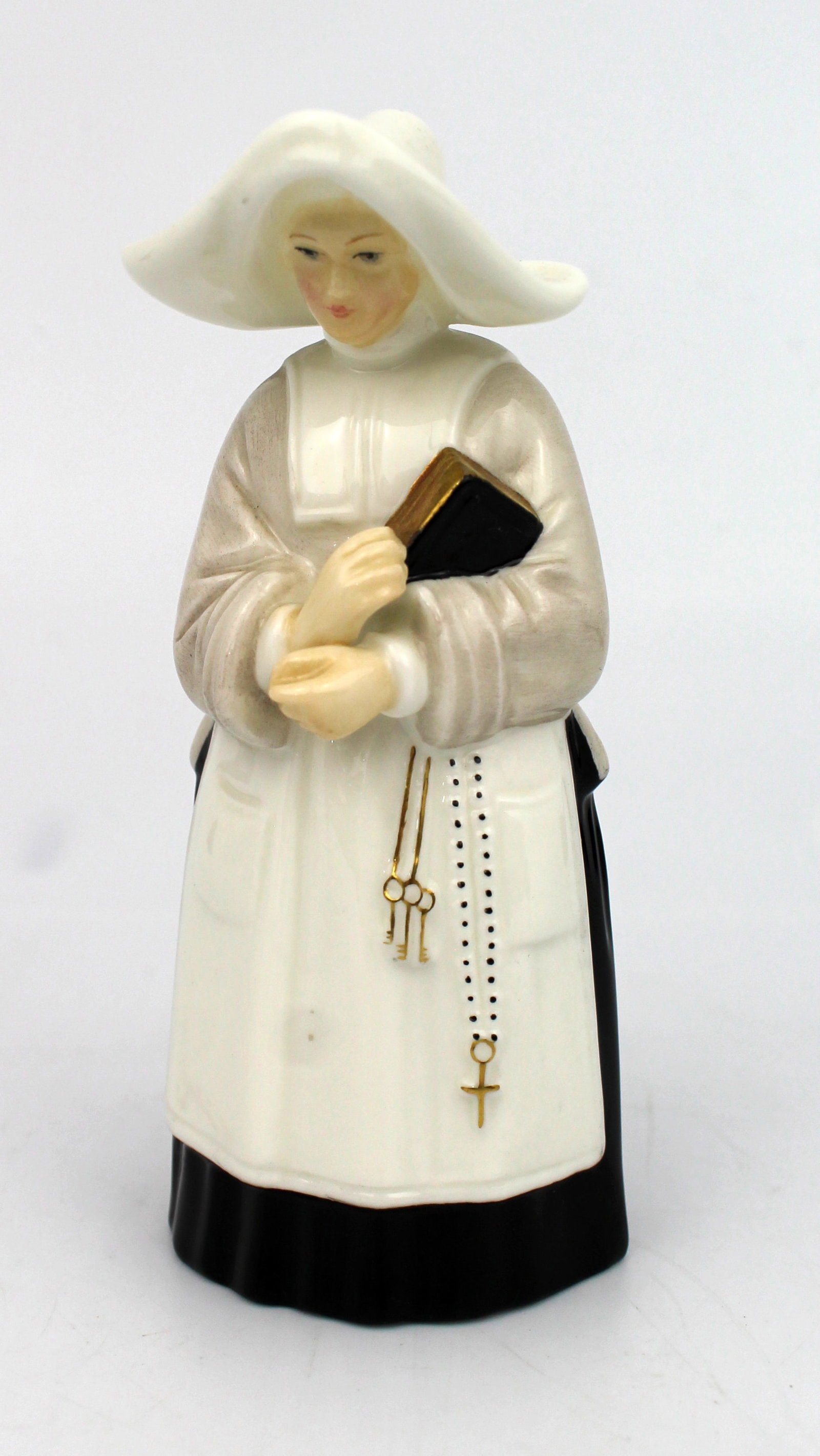 Title: Royal Worcester Nun Candle Snuffer Description: Royal Worcester Nun Candle Snuffer Condition: - 2
