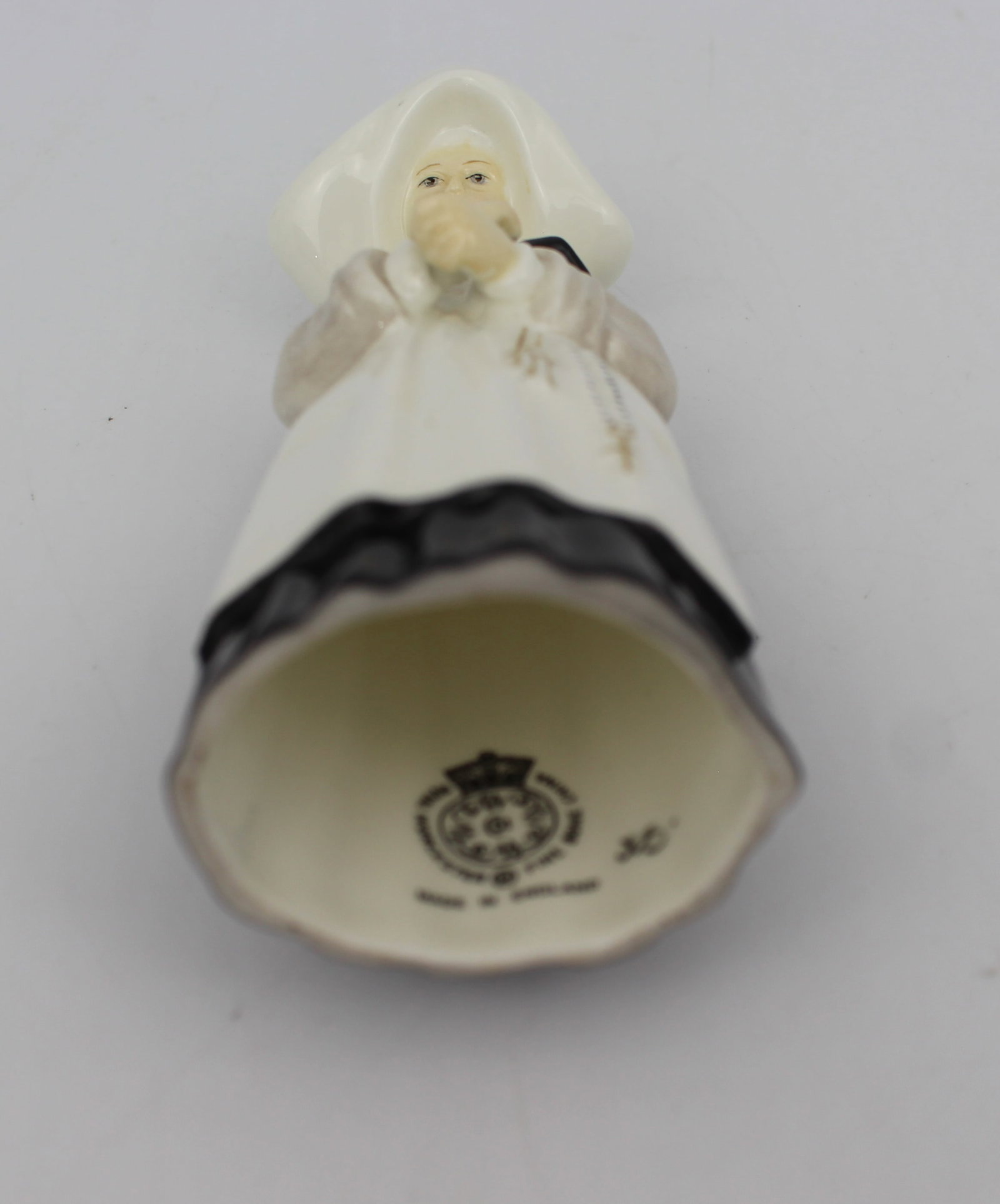 Title: Royal Worcester Nun Candle Snuffer Description: Royal Worcester Nun Candle Snuffer Condition: - 4