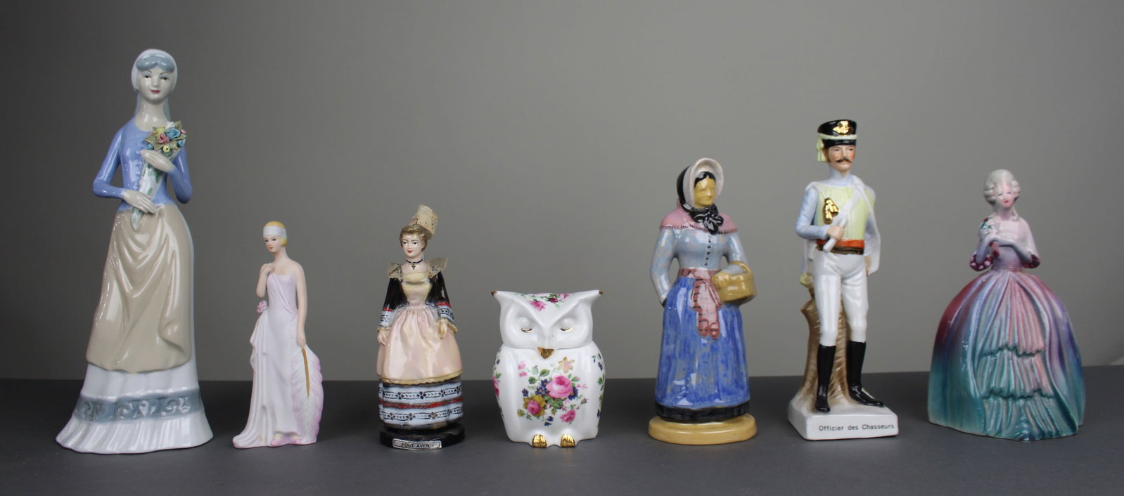 Title: Collection of 7 Porcelain Figurines Description: Collection of 7 Porcelain Figurines (1 of 3)