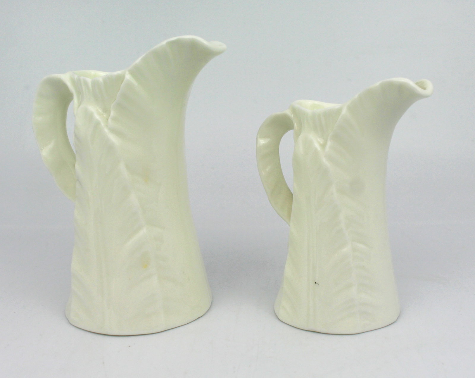 Title: Pair of Royal Worcester Leaf Jugs Description: Royal Worcester backstamp to one, the other: Title: Pair of Royal Worcester Leaf Jugs Description: Royal Worcester backstamp to one, the other without Condition: Used Delivery option: Collection & Delivery Location: WR1 Category: Antiques