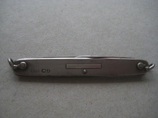 Title: George V RMS Queen Mary Silver Hafted Twin Steel Bladed Folding Penknife Description: - 10