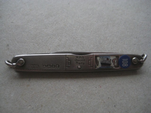 Title: George V RMS Queen Mary Silver Hafted Twin Steel Bladed Folding Penknife Description: - 9