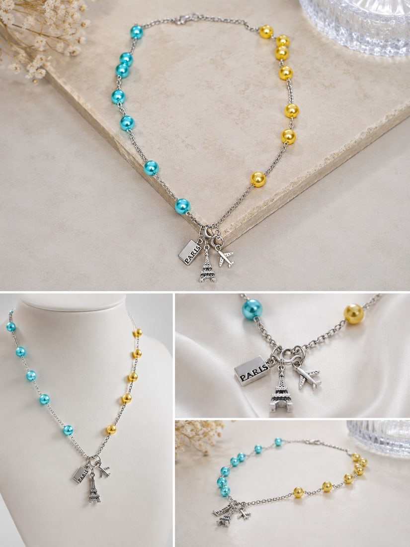 Paris Travel Charm Necklace with Blue and Gold Beads: Title: Paris Travel Charm Necklace with Blue and Gold Beads Description: Silver-tone chain necklace decorated with blue and gold beads and three travel-themed charms featuring the Eiffel Tower,