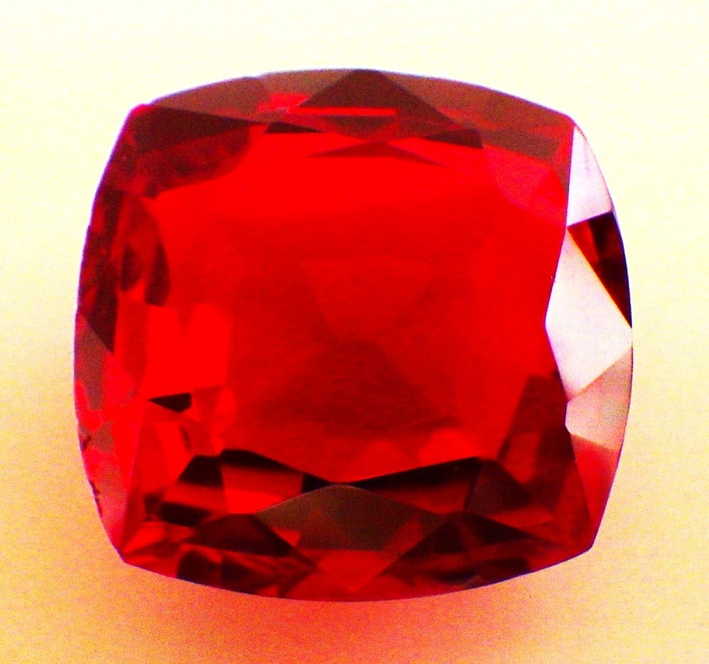 Cushion Cut Ruby 55 Carats: Title: Cushion Cut Ruby 55 Carats Description: A stunning piece of gemstone, a large (55 carats), cushion cut ruby. Pigeon blood red colour, lab created by the Czochralski method that uses