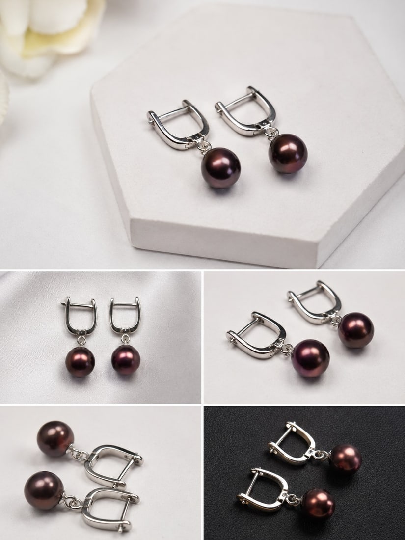 Dark Pearl Drop Earrings with Silver-Tone Clasps: Title: Dark Pearl Drop Earrings with Silver-Tone Clasps Description: Elegant pair of drop earrings featuring lustrous dark brown pearl-style beads suspended from polished silver-tone hinged clasps. A