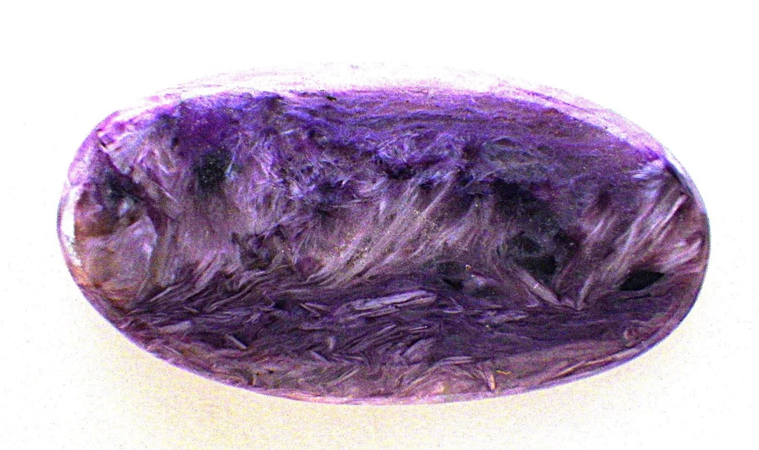 Rare Charoite Oval Cabochon 27 Carats: Title: Rare Charoite Oval Cabochon 27 Carats Description: A rare CHAROITE oval, polished cabochon. Dimensions: 32 x 16 x 4 mm, weight: 27.15 carats. Very collectable! Charoite is a rare