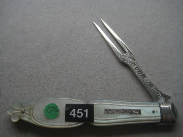 Victorian Mother of Pearl Hafted Silver Bladed Folding Fruit Fork: Title: Victorian Mother of Pearl Hafted Silver Bladed Folding Fruit Fork Description: Victorian Mother of Pearl Hafted Silver Bladed Folding Fruit Fork. The handle is carved into a