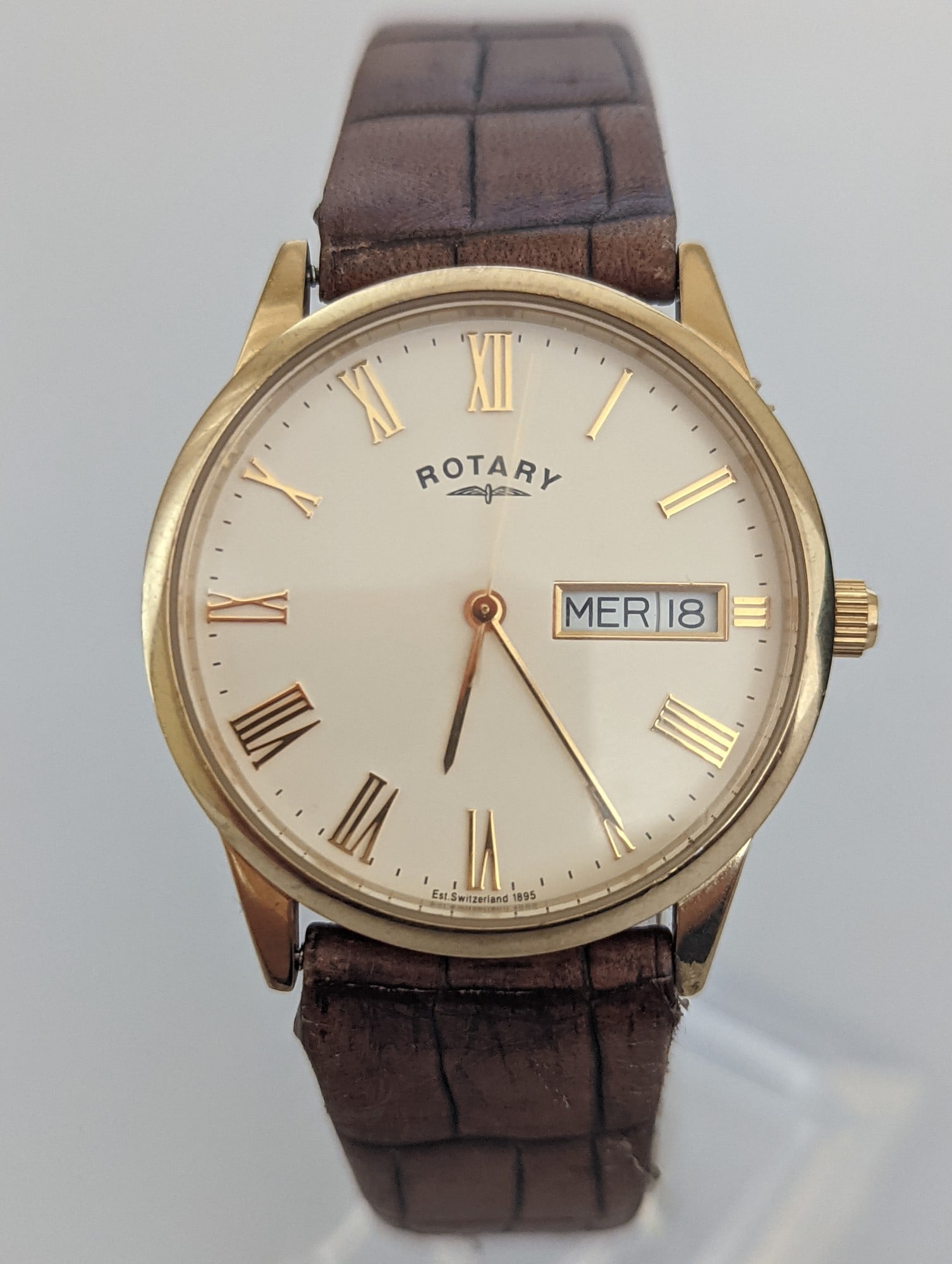 A Vintage Rotary Windsor Gold-Tone Day/Date: Title: A Vintage Rotary Windsor Gold-Tone Day/Date Description: A classic, elegant dress watch from Rotary, established in Switzerland in 1895. Key Features: • Brand: Rotary ̶
