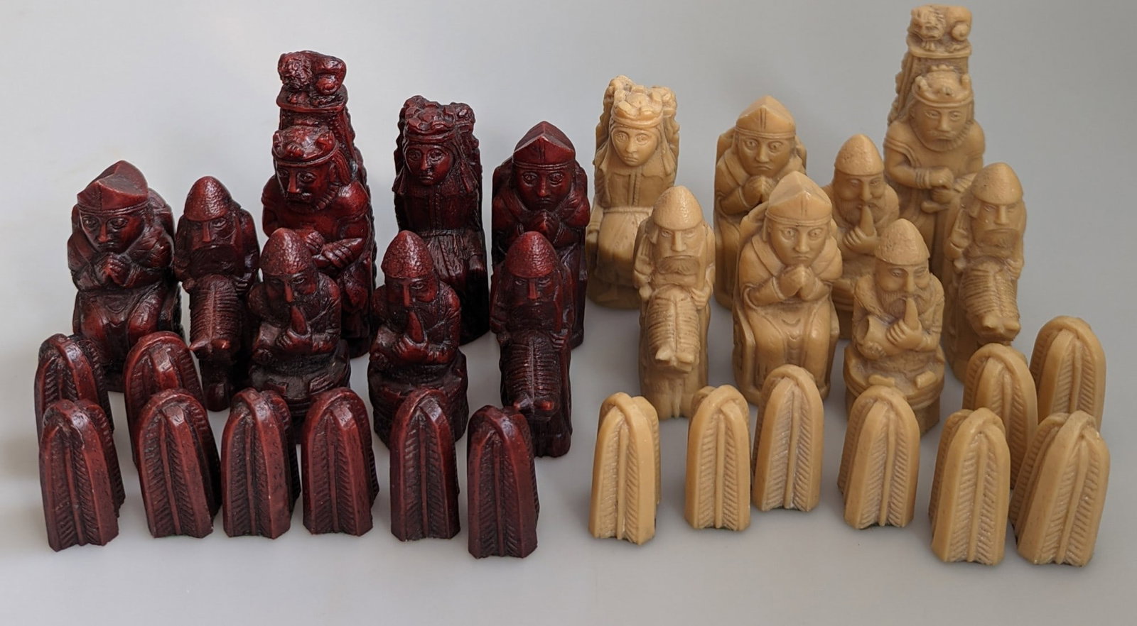 Vintage Lewis Chessmen Chess Set: Title: Vintage Lewis Chessmen Chess Set Description: A particularly attractive larger-sized set with highly detailed figural pieces in contrasting deep reddish-brown and antique ivory/cream finishe