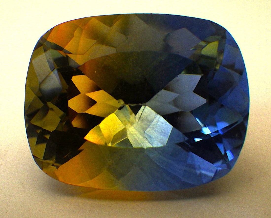 Radiant Cut, Bicoloured Tourmaline 43 Carats: Title: Radiant Cut, Bicoloured Tourmaline 43 Carats Description: A mesmerising, lab created (man made), colour enhanced, simulated, bicoloured tourmaline crystal. Radiant cut, dimensions: 24.5