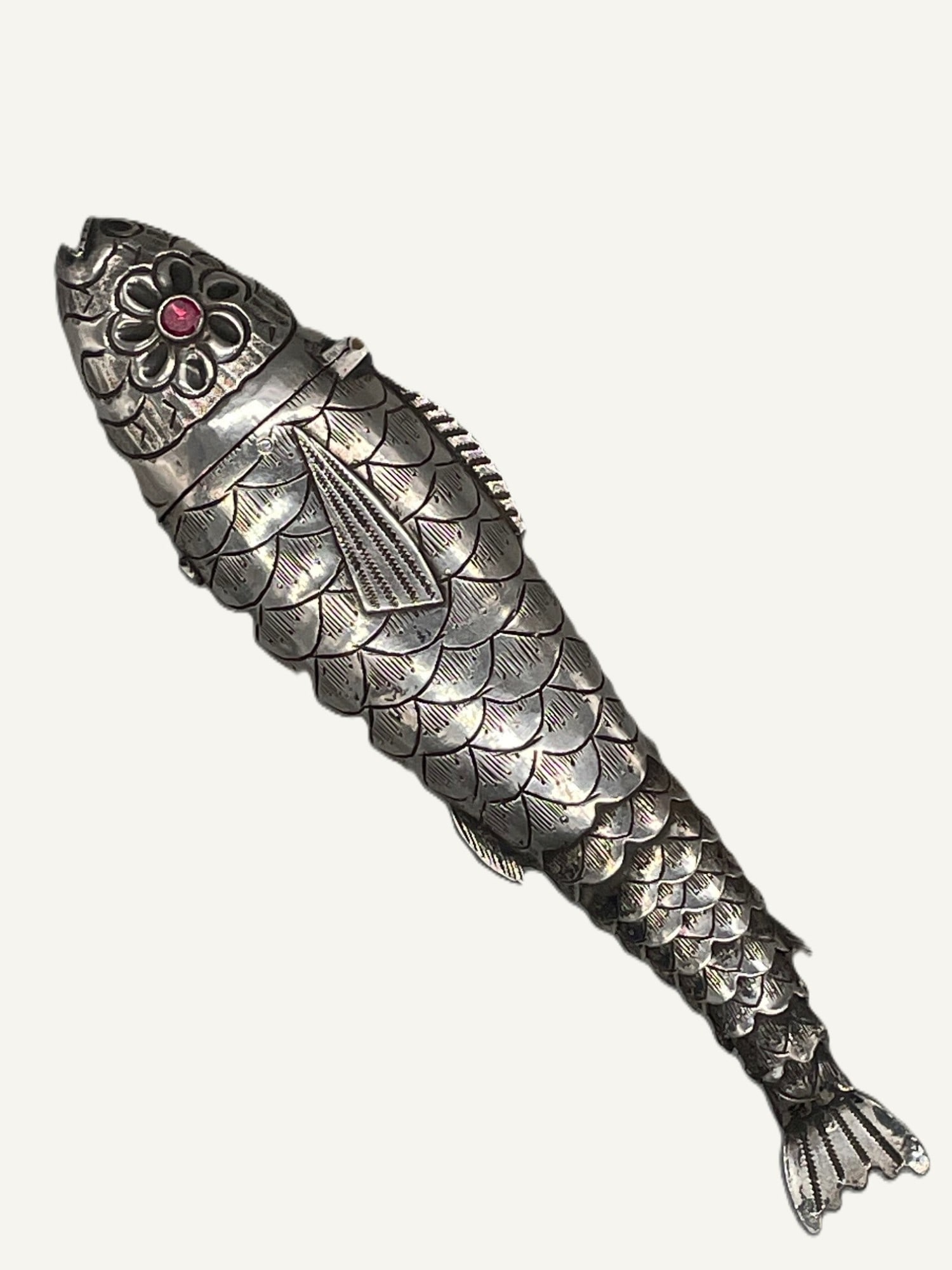 Silver Articulated Scent Bottle: Title: Silver Articulated Scent Bottle Description: Unmarked silver articulated fish scent bottle, set with pink glass eyes. Silver fish holds a glass bottle with its original stopper, length