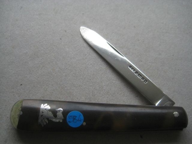 Victorian Silver Bladed Folding Fruit Knife: Title: Victorian Silver Bladed Folding Fruit Knife Description: Victorian Silver Bladed Folding Fruit Knife. The handle is inset with a silver crest on both sides of the handle. 