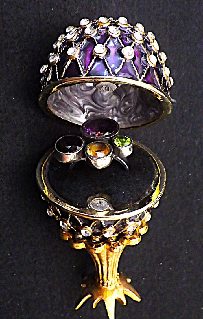 Gem Loaded Silver Ring In Faberge Style Egg: Title: Gem Loaded Silver Ring In Faberge Style Egg Description: A beautiful, hand made, sterling silver ring, hallmarked 925, with four gemstones (Amethyst, Peridot, Citrine, Garnet), size N, weight: