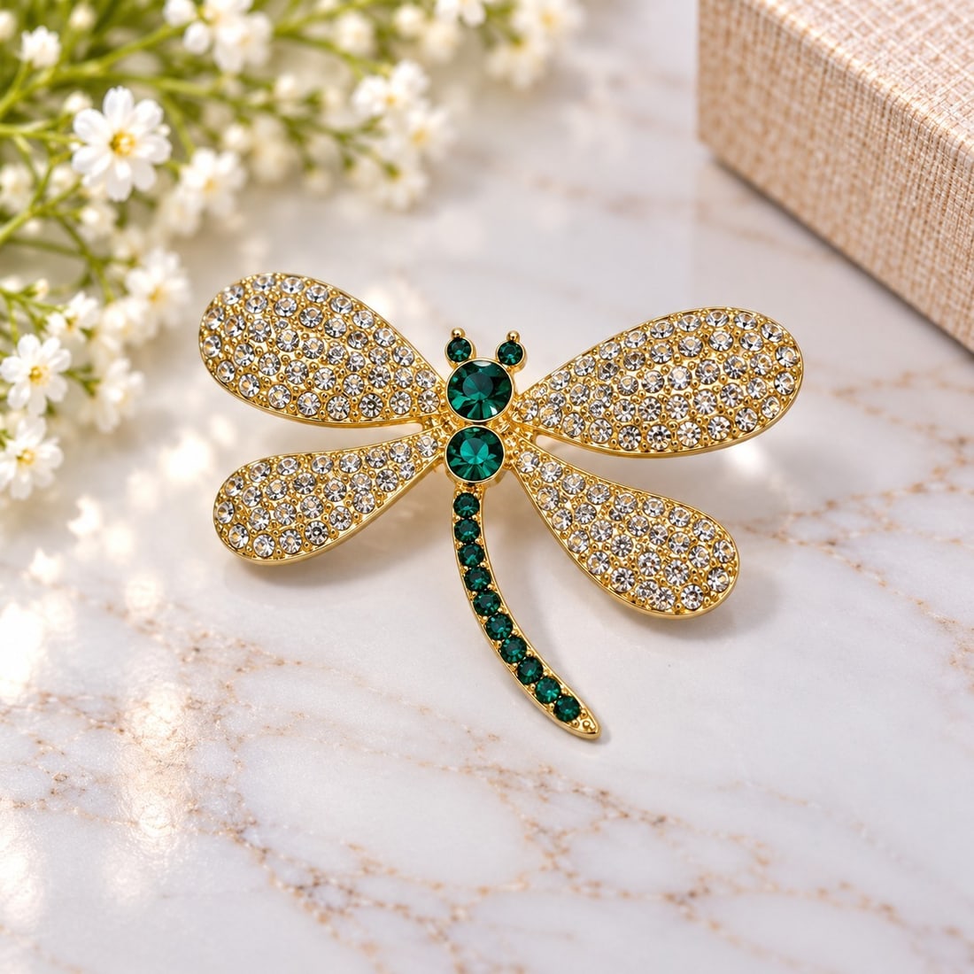 Gold Tone Dragonfly Brooch with Green & Clear Stones: Title: Gold Tone Dragonfly Brooch with Green & Clear Stones Description: Elegant dragonfly brooch in a gold-tone finish, beautifully decorated with sparkling clear stones across the wings and