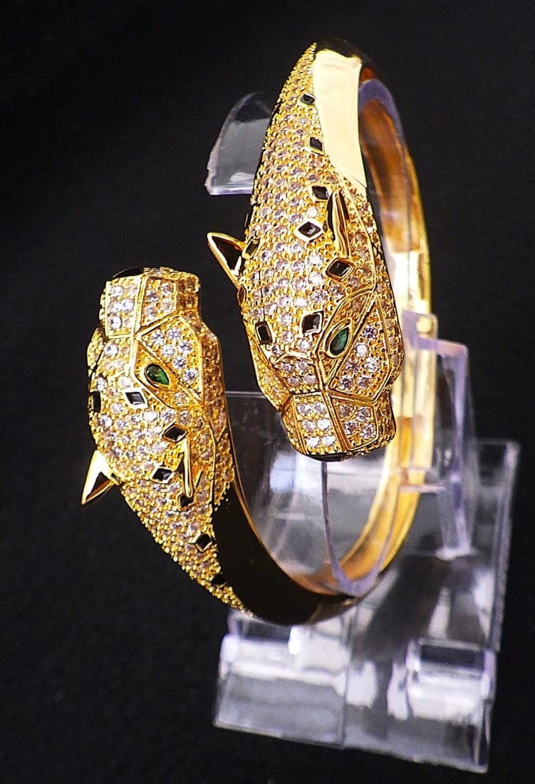 Title: A Gold Plated, Designer Style, Double Panther Headed Bangle With Cubic Zirconia. Description: - 2