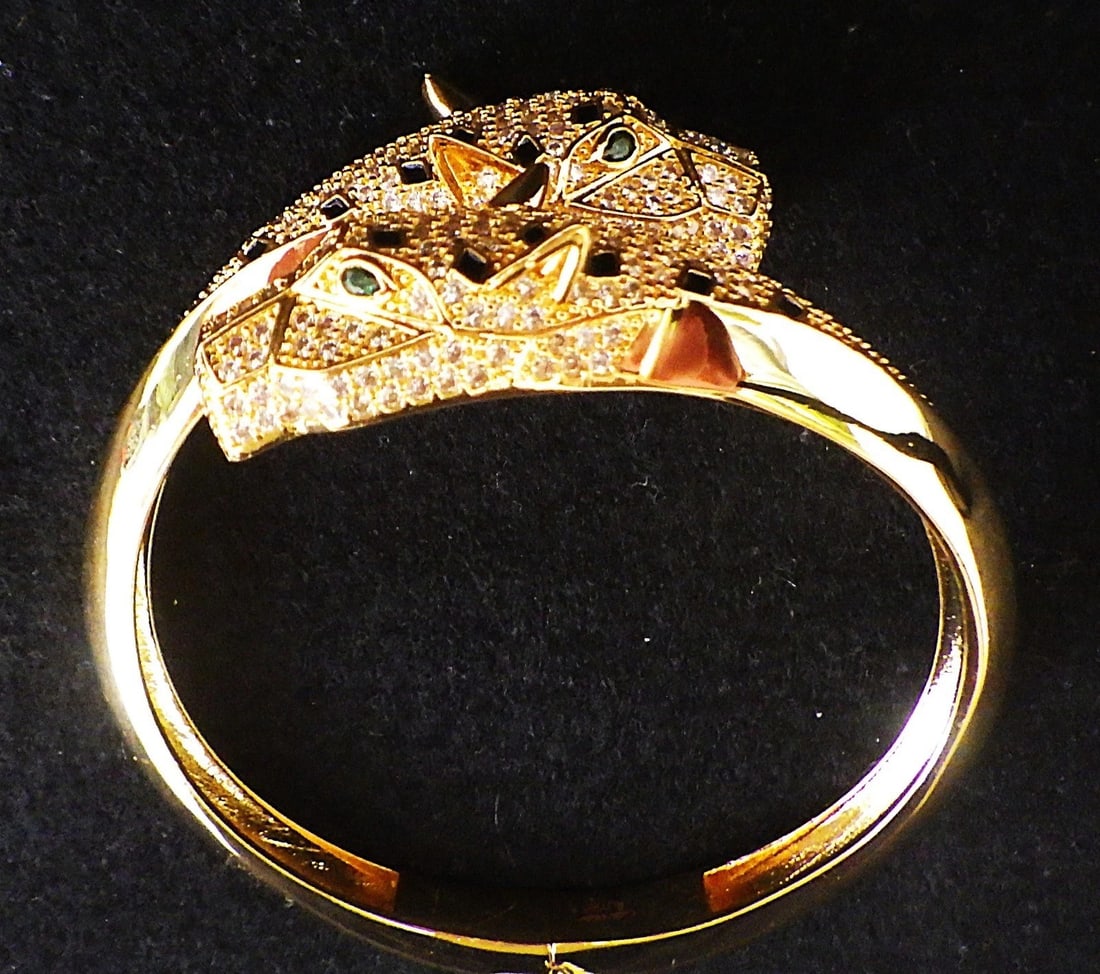 Title: A Gold Plated, Designer Style, Double Panther Headed Bangle With Cubic Zirconia. Description: - 3