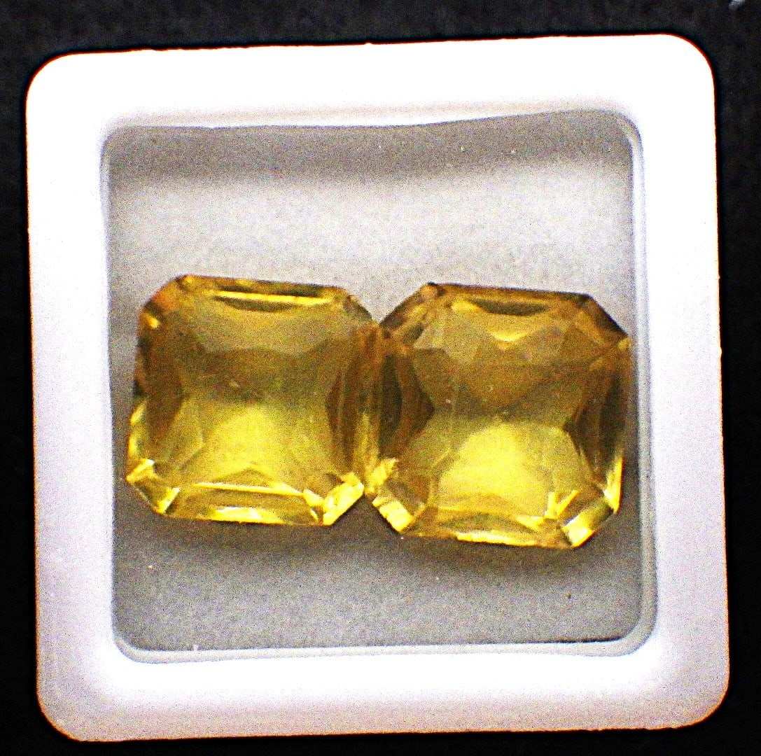 Pair Asscher Cur Yellow Sapphires 18 Carats (Total): Title: Pair Asscher Cur Yellow Sapphires 18 Carats (Total) Description: A near identical pair of asscher cut, simulated (man made) yellow sapphires. Dimensions: 10 x 10 x 6 mm (each), total