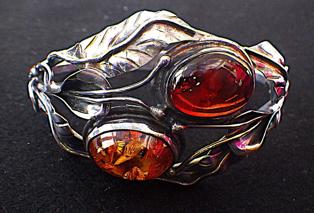 Art Nouveau Sterling Silver Baltic Amber Bangle: Title: Art Nouveau Sterling Silver Baltic Amber Bangle Description: A fabulous, uniquely created, top quality, antique, Art Nouveau, sterling silver bangle with two Baltic amber cabochons. Hand