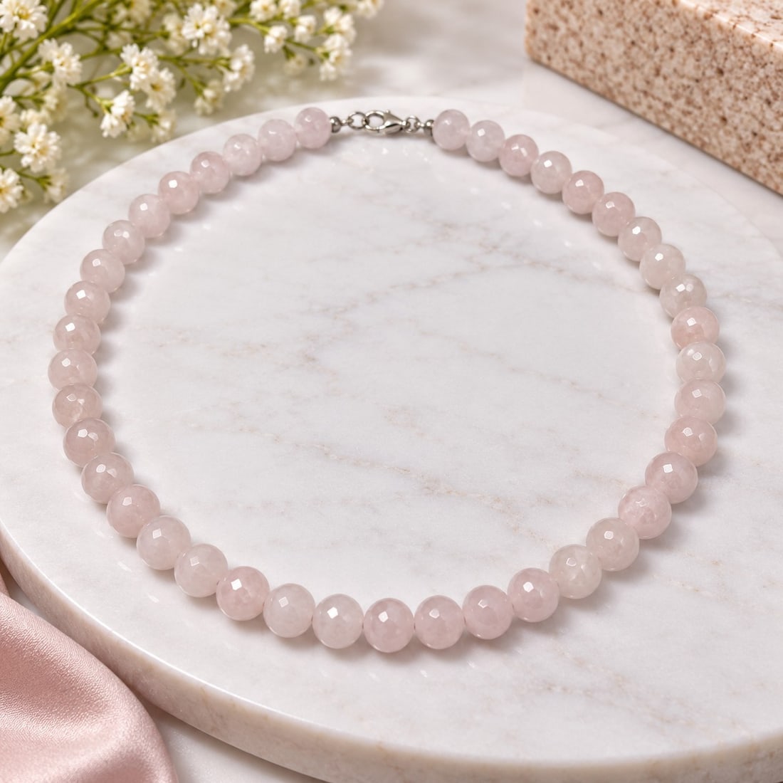 Faceted Pink Bead Necklace with Silver-Tone Clasp: Title: Faceted Pink Bead Necklace with Silver-Tone Clasp Description: Elegant necklace featuring softly coloured pale pink faceted round beads, creating a delicate sparkle and refined appearance.