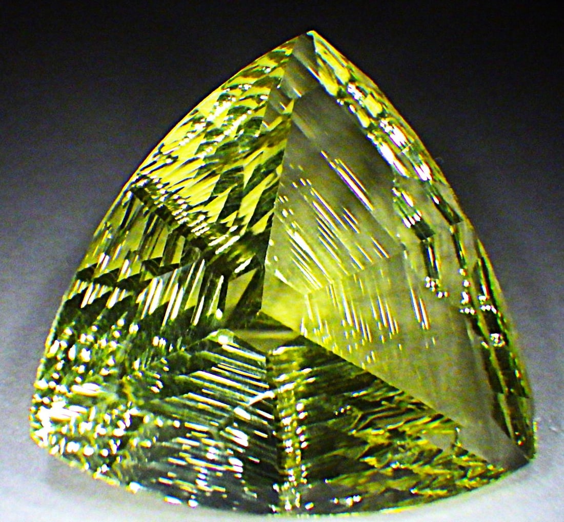Custom Trillion Cut Citrine 31 Carats: Title: Custom Trillion Cut Citrine 31 Carats Description: A mesmerising, custom trillion cut, Citrine with excellent colour saturation and uniformity, without inclusions or any other issues. 