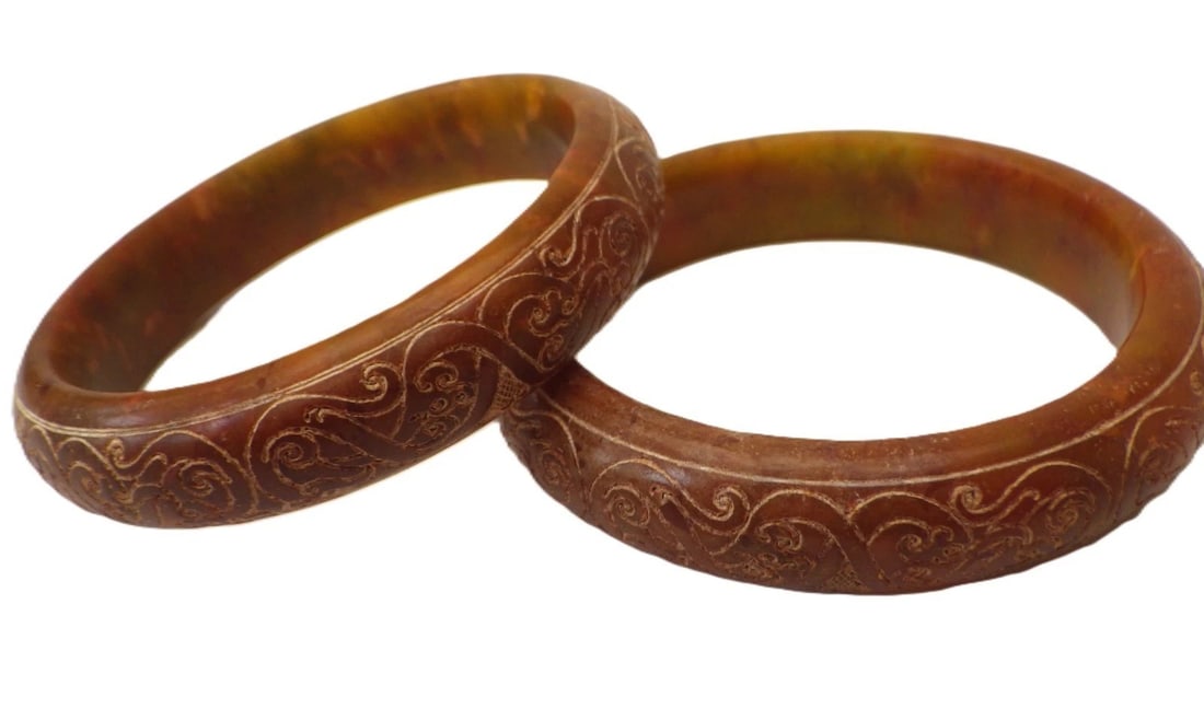 A Pair of Traditional Chinese Hand Carved Vintage Jade Bangles: Title: A Pair of Traditional Chinese Hand Carved Vintage Jade Bangles Description: A rare and wonderful pair of Chinese, vintage (or possibly older), hand carved reddish-brown jade bracelets, with a