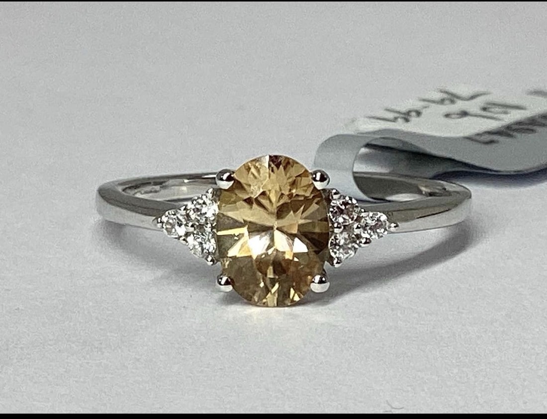 9ct White Gold 1.52ct Ceylon & White Zircon Dress Ring, N1/2: Title: 9ct White Gold 1.52ct Ceylon & White Zircon Dress Ring, N1/2 Description: The Genuine Gemstone Company A 9ct White gold 1.52 ct Ceylon & White Zircon dress ring, oval claw set,