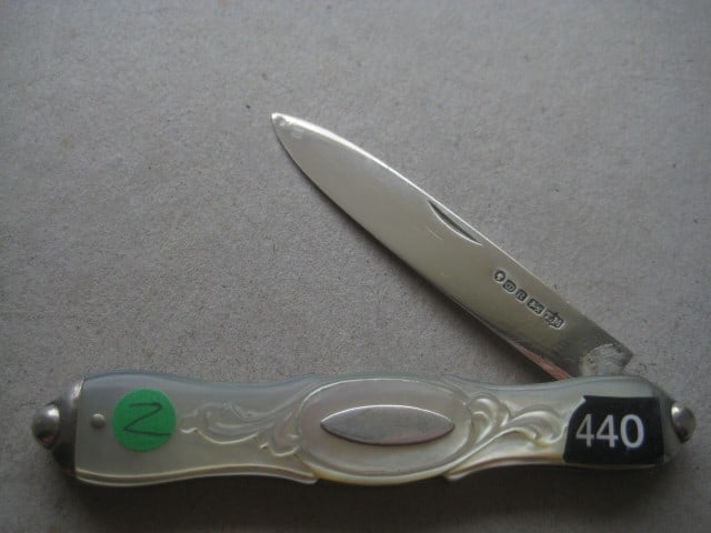 Victorian Mother of Pearl Hafted Silver Bladed Folding Fruit Knife: Title: Victorian Mother of Pearl Hafted Silver Bladed Folding Fruit Knife Description: Victorian Mother of Pearl Hafted Silver Bladed Folding Fruit Knife. The handle is carved into a floral