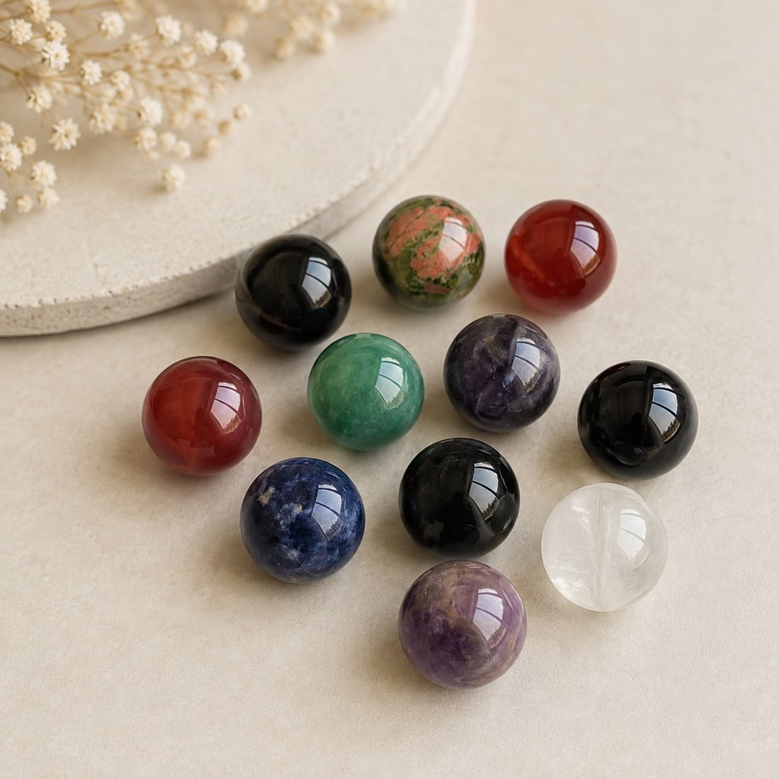 Set of 11 Mixed Gemstone Spheres – 15mm: Title: Set of 11 Mixed Gemstone Spheres – 15mm Description: Attractive collection of 11 polished gemstone spheres, featuring a variety of colours and natural-looking patterns, including black,