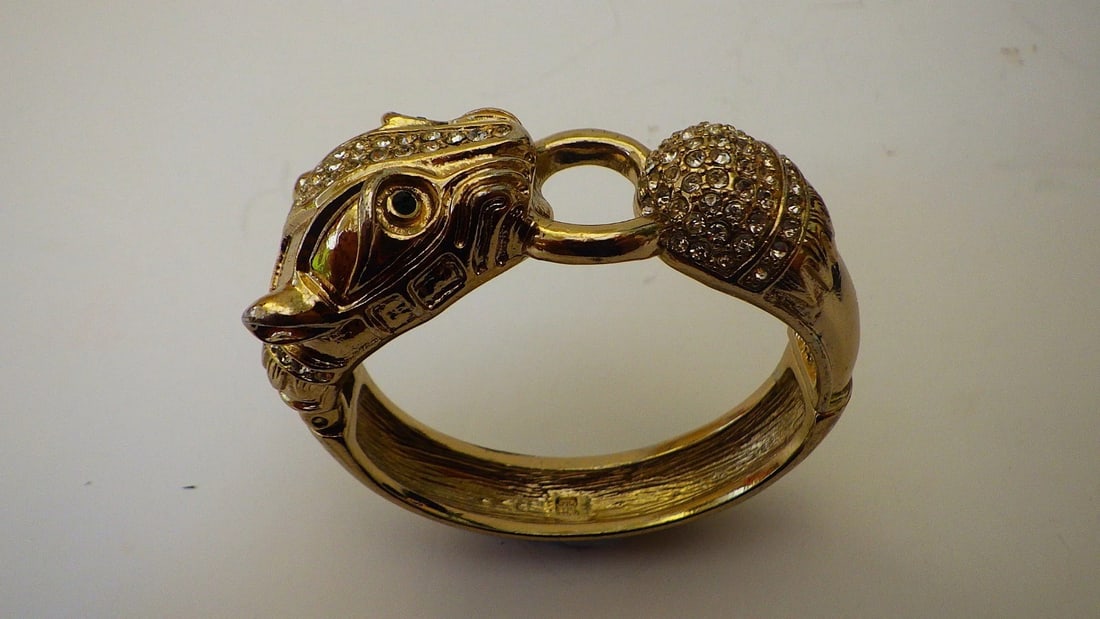 Vintage, Glamorous Panther Bangle With Cubic Zirconia: Title: Vintage, Glamorous Panther Bangle With Cubic Zirconia Description: A vintage, gold plated, fancy panther bangle with cubic zirconia. In a presentation box. Overall dimensions: 68 x