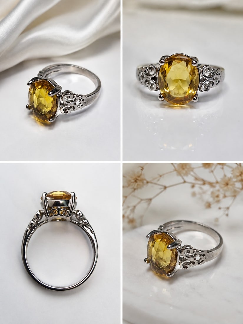 Yellow Gemstone Silver Ring with Ornate Filigree Design: Title: Yellow Gemstone Silver Ring with Ornate Filigree Design Description: Elegant silver-tone ring featuring a faceted oval yellow gemstone in a classic four-prong setting. The shoulders are