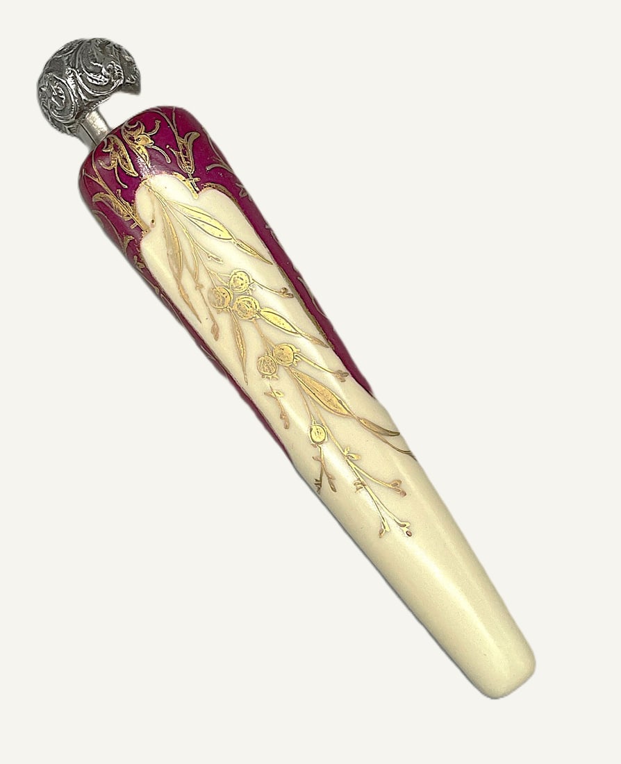 Late Victorian Scent Bottle: Title: Late Victorian Scent Bottle Description: Late Victorian laydown ceramic scent bottle, gilt decoration over red and ivory ground. Silver mount, hallmarked Charles May, 1901. Length