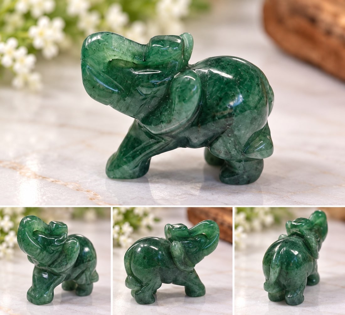 Carved Green Stone Elephant Figurine: Title: Carved Green Stone Elephant Figurine Description: Decorative elephant figurine hand-carved from polished green stone, featuring a raised trunk and attractive natural colour variations. A