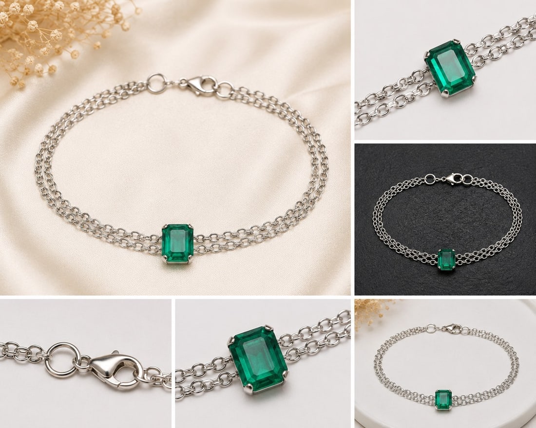 Emerald Doublet Double-Chain Bracelet: Title: Emerald Doublet Double-Chain Bracelet Description: Elegant silver-tone double-chain bracelet featuring a rectangular emerald doublet centre stone. The emerald doublet is a composite stone