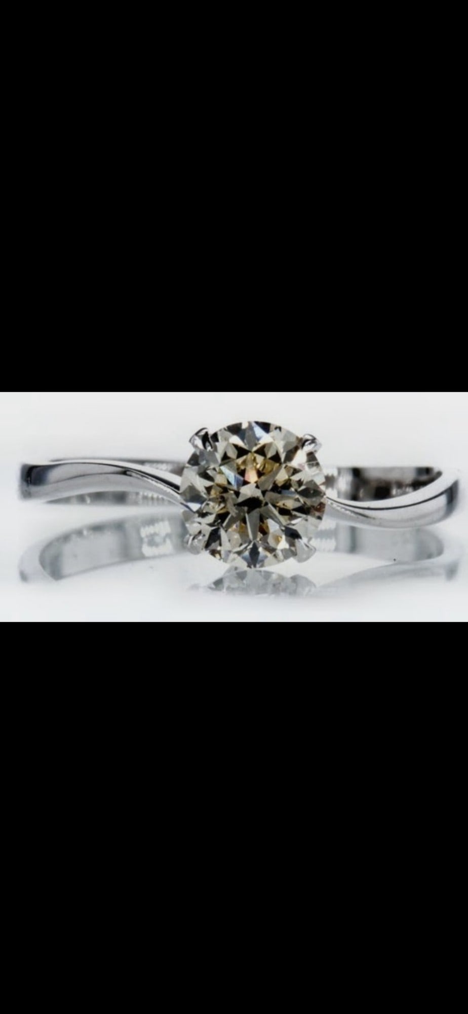 Modern 14ct White Gold Single-Stone Ring With A Twisted/Bypass Shank and Four-claw Solitaire Head: Title: Modern 14ct White Gold Single-Stone Ring With A Twisted/Bypass Shank and Four-claw Solitaire Head Description: 14k white gold ring set with a yellow diamond, papers stating 0.91ct, GCI