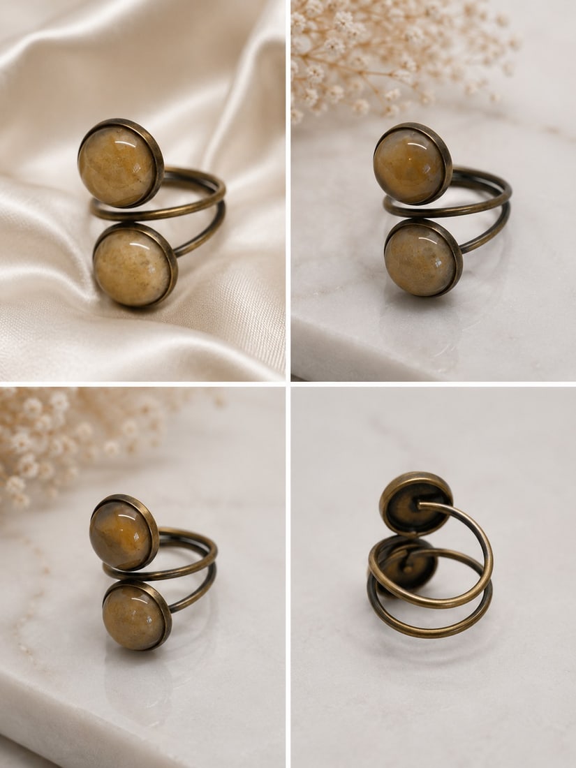 Double Stone Spiral Adjustable Ring: Title: Double Stone Spiral Adjustable Ring Description: Distinctive open spiral ring featuring two round polished beige cabochon stones in antique bronze-tone settings. The double-stone design
