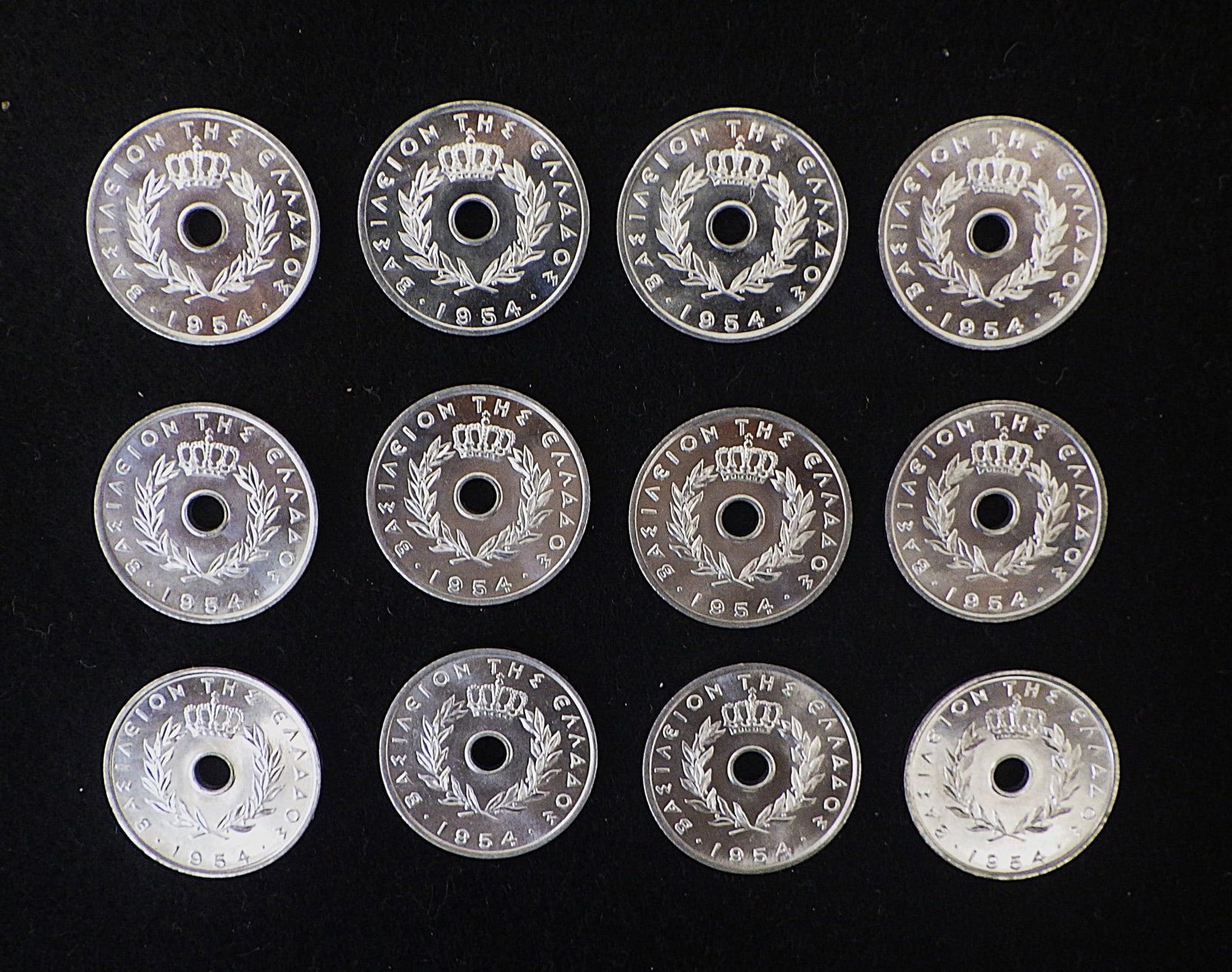 Twelve 5 LEPTA Greek Coins 1954 Mint Condition: Title: Twelve 5 LEPTA Greek Coins 1954 Mint Condition Description: A rare and highly collectable dozen of Greek coins with value "5 LEPTA" and dated 1954, engraved by the renowned sculptor Vassilis