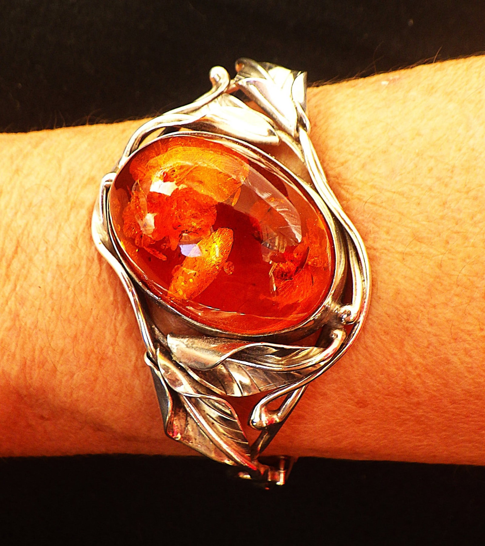 Art Nouveau Silver Bangle With Large Natural Amber Cabochon: Title: Art Nouveau Silver Bangle With Large Natural Amber Cabochon Description: A wonderful, top quality, Art Nouveau, sterling silver bangle with large oval Baltic amber cabochon. Hand made by