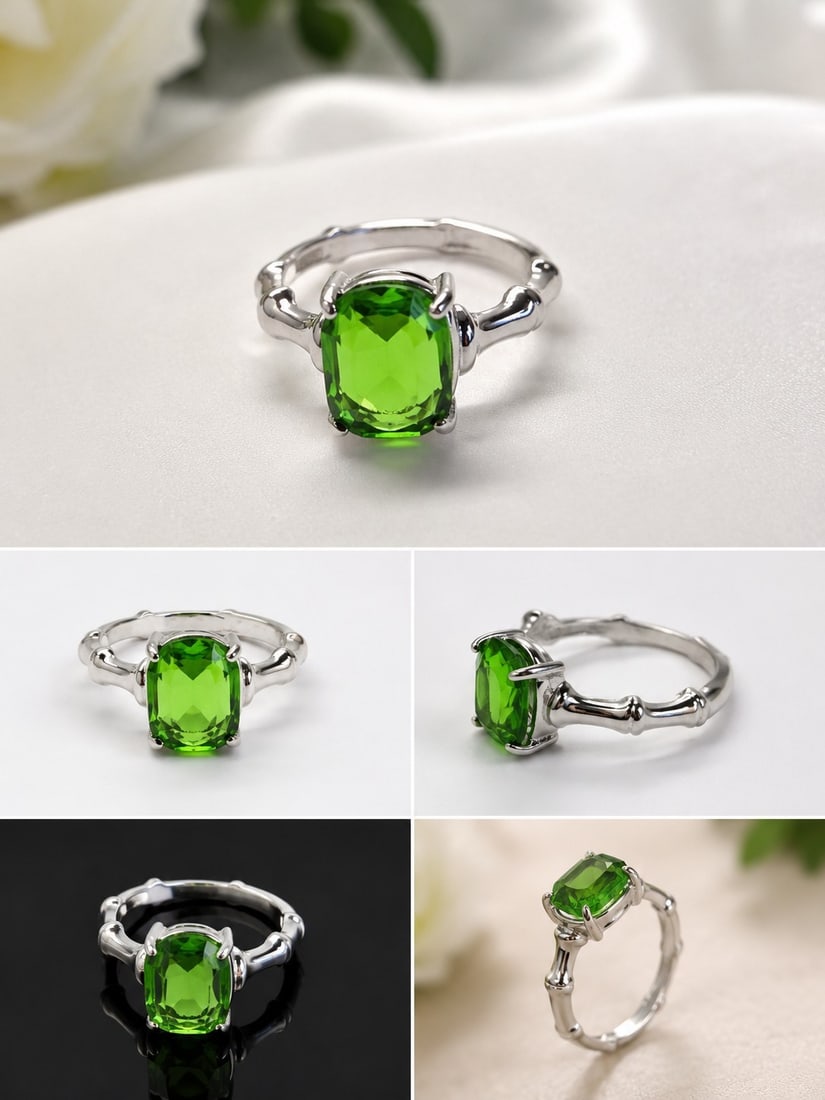 Green Gemstone Adjustable Silver-Tone Ring: Title: Green Gemstone Adjustable Silver-Tone Ring Description: Elegant adjustable ring featuring a vibrant rectangular cushion-cut green gemstone in a polished silver-tone setting. The decorative