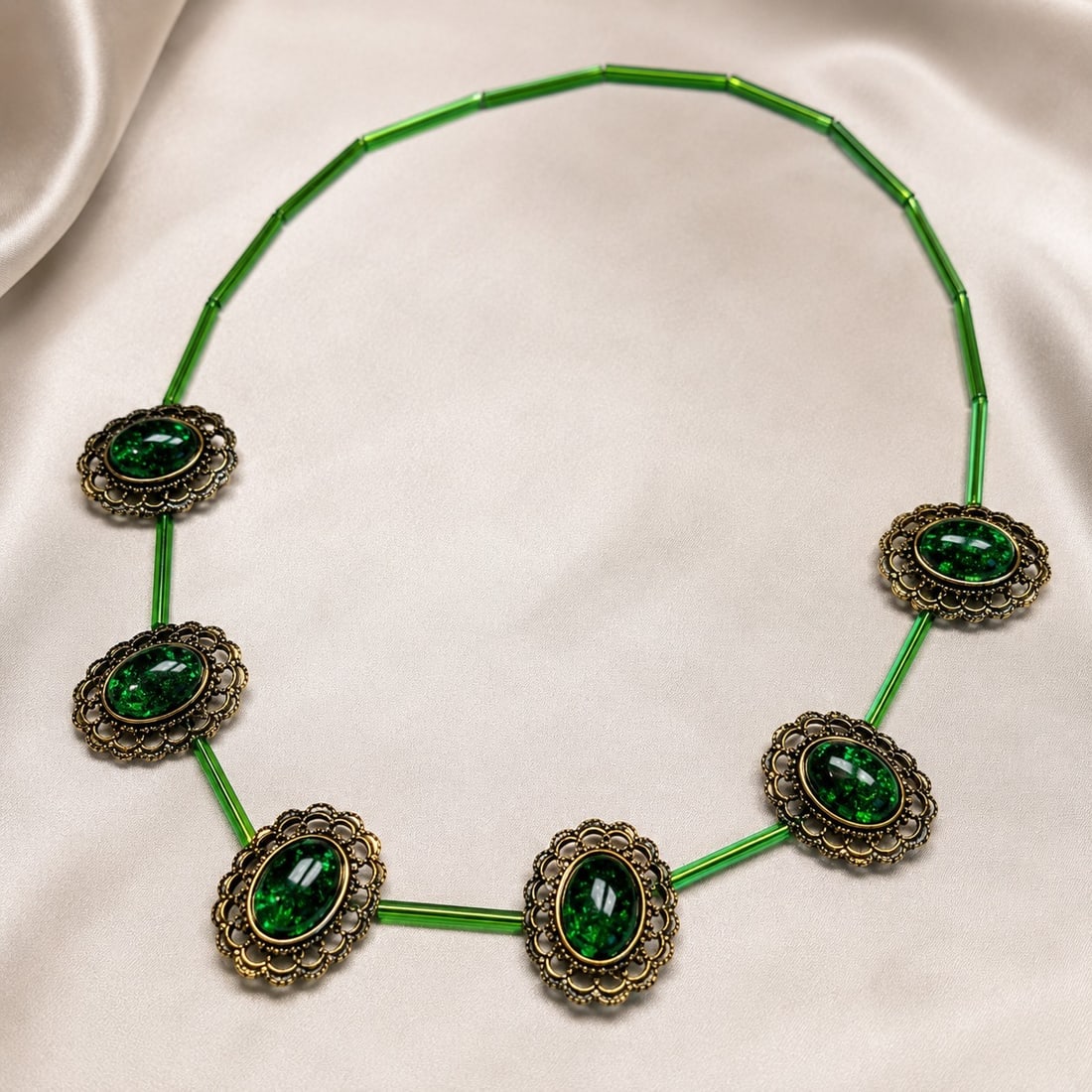 Vintage-Style Green Statement Necklace with Ornate Oval Cabochons: Title: Vintage-Style Green Statement Necklace with Ornate Oval Cabochons Description: Striking statement necklace featuring six oval green cabochons in ornate antique-tone floral settings, connected