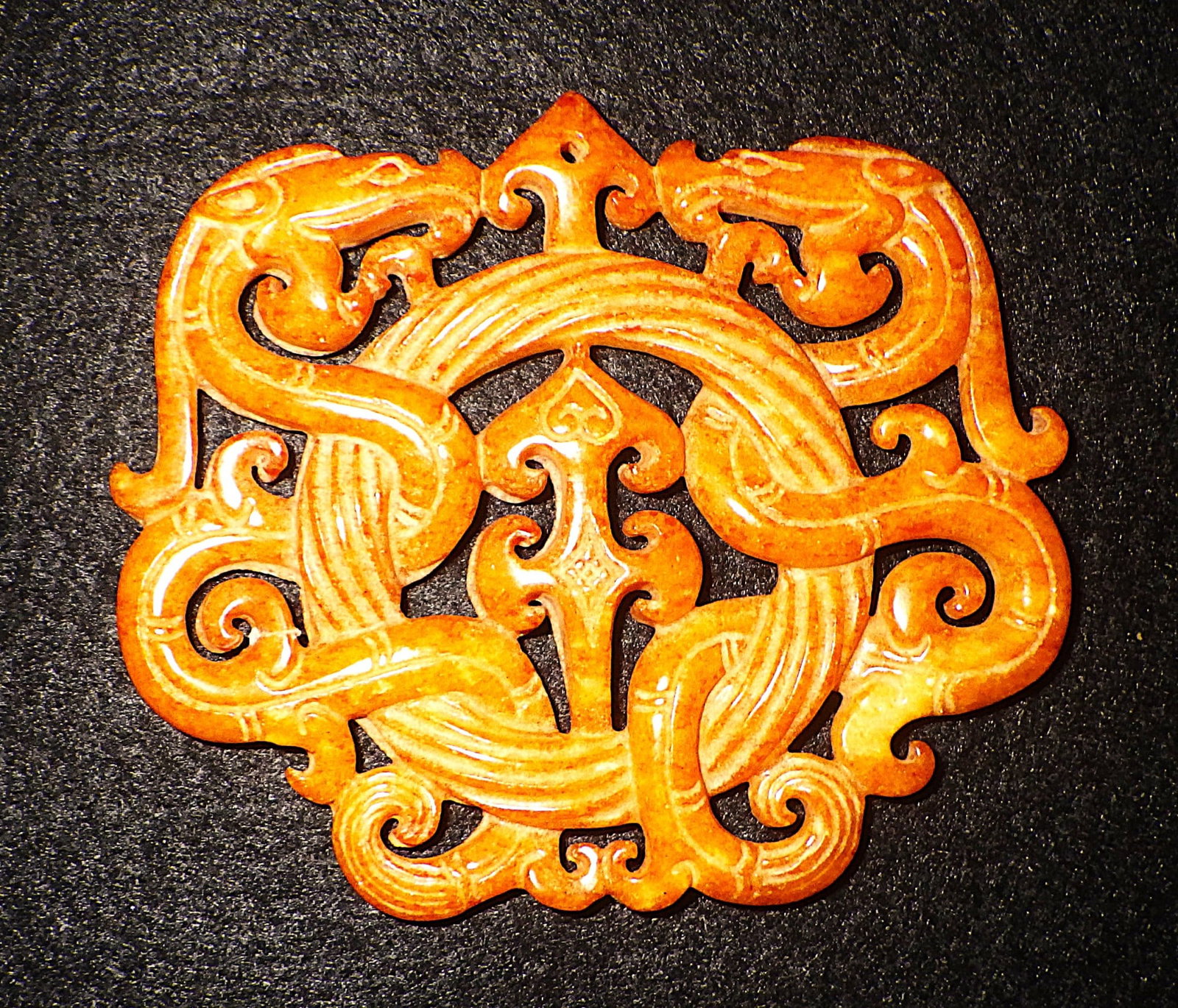 Vintage Chinese Hand Carved Orange Jade Amulet With Mythological Beasts: Title: Vintage Chinese Hand Carved Orange Jade Amulet With Mythological Beasts Description: A Vintage, Chinese, hand carved orange jade amulet with two guarding mythological beasts. In clean