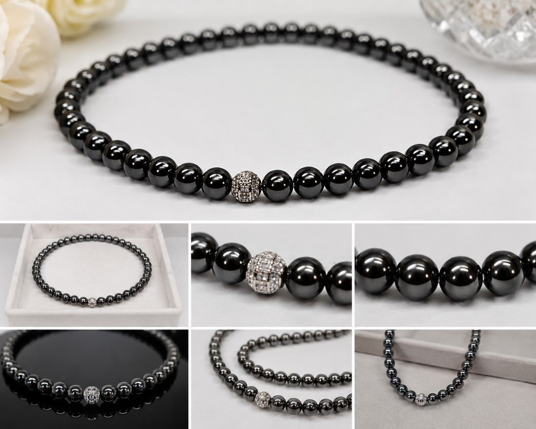 Hematite Bead Necklace with Sparkling Crystal Centre Bead: Title: Hematite Bead Necklace with Sparkling Crystal Centre Bead Description: Elegant necklace featuring polished dark metallic beads, believed to be hematite, with a substantial heavy feel. Finished