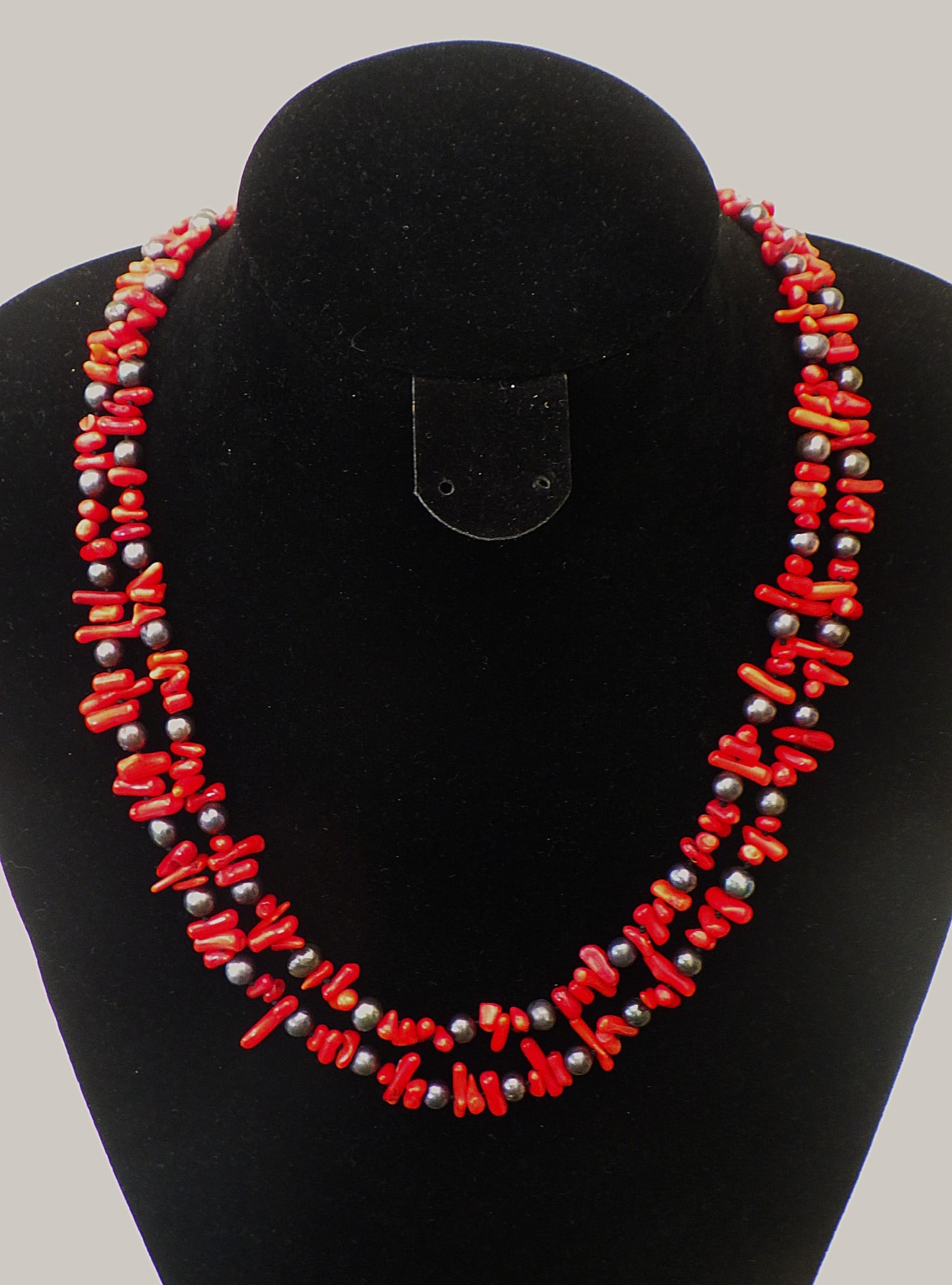 Two Strand Red Coral and Natural Black Pearl Necklace: Title: Two Strand Red Coral and Natural Black Pearl Necklace Description: A beautiful and very feminine two row necklace with red coral and genuine black cultured pearls. Length: 50