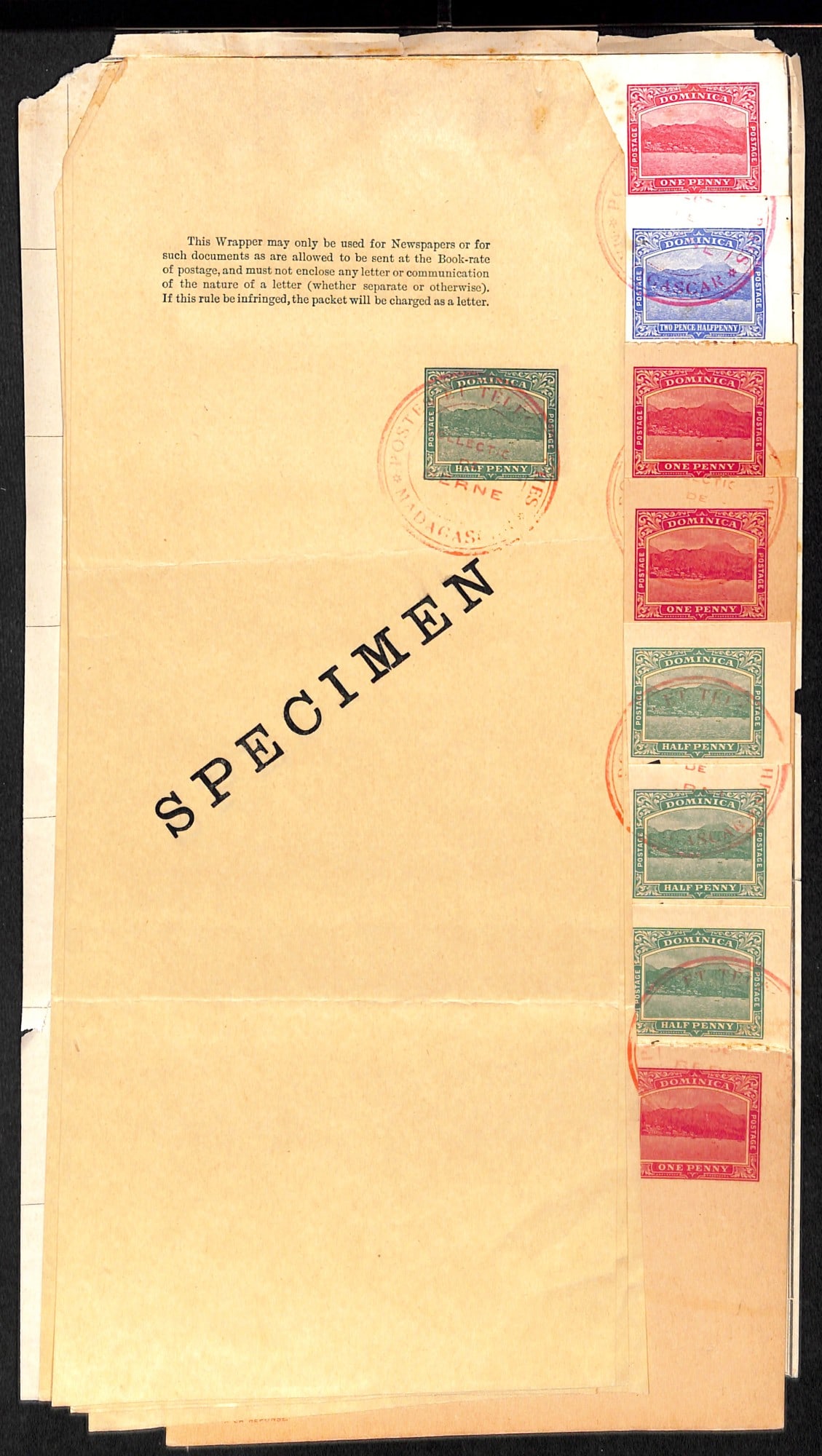 Title: Dominica 1903 Description: Postal stationery - 1/2d (3), 1d Post Cards, 1d + 1d Reply Card (: Title: Dominica 1903 Description: Postal stationery - 1/2d (3), 1d Post Cards, 1d + 1d Reply Card (2), 1d, 2.1/2d Envelopes, 1/2d (2), 1d (2) Wrappers, all overprinted "SPECIMEN" and affixed to a