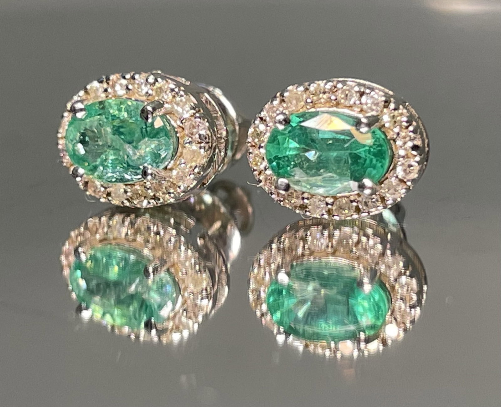 Beautiful Natural Emerald Halo Set Stud Earrings 18k White Gold: Title: Beautiful Natural Emerald Halo Set Stud Earrings 18k White Gold Description: Beautiful Natural Emerald Halo Set Stud Earrings 18k White Gold. Very Beautiful Earrings will make someone