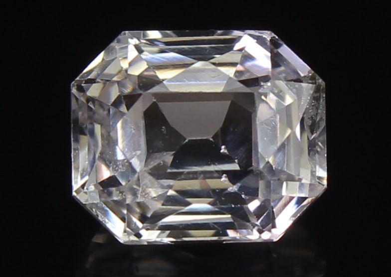 White Sapphire, 1.32 CT: Title: White Sapphire, 1.32 CT Description: Species: Corundum Variety: Sapphire Shape: Radiant mixed Cut Measurements: 6.28x5.28x4.01mm Colour: Colourless Certificate: